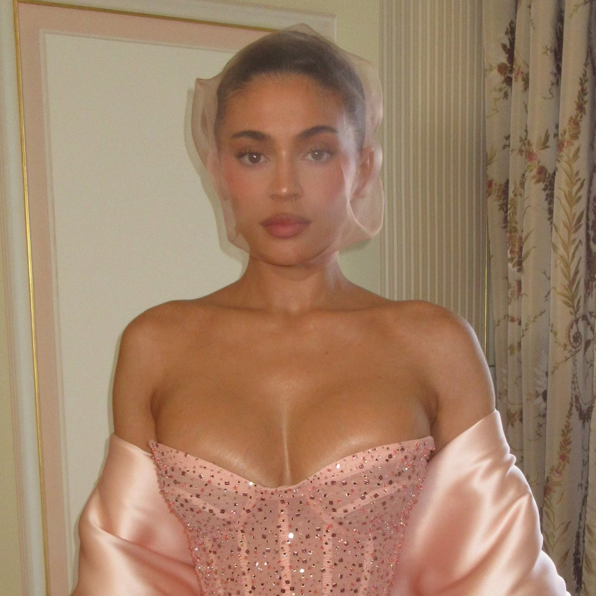 kylie jenner paris fashion week 2024 dress Kylie Jenner at Schiaparelli in Pink Corset Dress & Net Headpiece